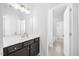 Bright bathroom features a dark vanity and modern finishes at 4508 Valley Crest Ln, Fuquay Varina, NC 27526