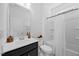 Bright bathroom features a shower and tub combination and modern fixtures and finishes at 4508 Valley Crest Ln, Fuquay Varina, NC 27526
