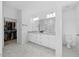 Bright bathroom boasts a walk-in closet, glass shower, double vanity, and modern finishes at 4508 Valley Crest Ln, Fuquay Varina, NC 27526