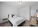 Simple bedroom with a bed, side table, and television at 4508 Valley Crest Ln, Fuquay Varina, NC 27526