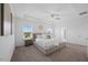 Spacious bedroom with tray ceilings, natural light, and an ensuite bathroom at 4508 Valley Crest Ln, Fuquay Varina, NC 27526