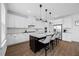 Modern kitchen features white cabinets, granite countertops, and stainless steel appliances at 4508 Valley Crest Ln, Fuquay Varina, NC 27526