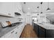 Gourmet kitchen boasts white cabinets, granite countertops, and stainless steel appliances at 4508 Valley Crest Ln, Fuquay Varina, NC 27526