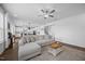 Open-concept living room featuring hardwood floors and lots of natural light at 4508 Valley Crest Ln, Fuquay Varina, NC 27526