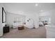 Bright living room with modern décor, an open floor plan, and access to other rooms at 4508 Valley Crest Ln, Fuquay Varina, NC 27526