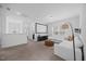 Open-concept living room with a projector screen, contemporary decor, and ample seating at 4508 Valley Crest Ln, Fuquay Varina, NC 27526