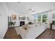 Bright living room features hardwood floors, a fireplace, and large windows at 4508 Valley Crest Ln, Fuquay Varina, NC 27526