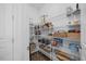 Walk-in pantry with ample shelving for storage at 4508 Valley Crest Ln, Fuquay Varina, NC 27526