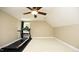Bonus room features a treadmill, providing space for a home gym or exercise area at 4601 Basilica Dr, Holly Springs, NC 27540