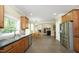 Spacious kitchen featuring stainless steel appliances, tile flooring, and ample cabinet space at 4601 Basilica Dr, Holly Springs, NC 27540