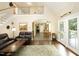 Open living room with hardwood floors, a fireplace, and staircase leading to the second level at 4601 Basilica Dr, Holly Springs, NC 27540