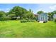 Expansive backyard featuring a storage shed and lush green lawn at 5 Windsor Pl, Mebane, NC 27302