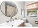Updated bathroom with tile floors, modern fixtures, and neutral colored shower curtain at 5 Windsor Pl, Mebane, NC 27302