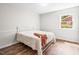 Cozy bedroom features neutral walls, updated floors, and bright natural light at 5 Windsor Pl, Mebane, NC 27302