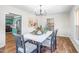 Charming dining room featuring a large table, decorative centerpiece, and modern lighting, perfect for gatherings at 5 Windsor Pl, Mebane, NC 27302