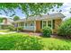 Charming single-story home with a well-manicured front yard and inviting porch at 5 Windsor Pl, Mebane, NC 27302