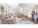 Inviting living room with cozy seating, a decorative rug, and ample natural light, perfect for relaxation at 5 Windsor Pl, Mebane, NC 27302