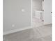 Neutral-colored hallway with carpet and white trim and a view to other rooms through the open doorway at 509 Sherron Road # 9, Durham, NC 27703