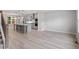 Open-concept kitchen with gray island, stainless steel appliances and pendant lighting at 509 Sherron Road # 9, Durham, NC 27703