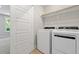 Bright laundry room with a large modern washer and dryer at 509 Sherron Road # 9, Durham, NC 27703