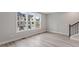 Sun-filled living room featuring big windows and modern floors at 509 Sherron Road # 9, Durham, NC 27703