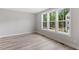 Bright living room with big windows and modern floors at 509 Sherron Road # 9, Durham, NC 27703