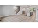 Open-concept living space with modern floors and staircase at 509 Sherron Road # 9, Durham, NC 27703