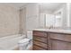 This is a bathroom featuring a tub, toilet, wood vanity, granite countertop, and tile backsplash at 509 Sherron Road Dr # 10, Durham, NC 27703