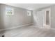 Bedroom featuring two windows and a doorway to an adjacent room, with soft carpet flooring at 509 Sherron Road Dr # 10, Durham, NC 27703