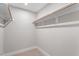 Walk-in closet with ample storage and wooden rods for organized wardrobe and accessories at 509 Sherron Road Dr # 10, Durham, NC 27703
