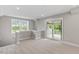 A cozy living room featuring sliding glass doors to the balcony at 509 Sherron Road Dr # 10, Durham, NC 27703