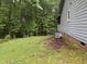 A tranquil backyard setting with mature trees and space for outdoor enjoyment at 535 Hillcrest Dr, Garner, NC 27529