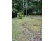 A spacious backyard with lush greenery and mature trees, perfect for nature lovers at 535 Hillcrest Dr, Garner, NC 27529