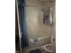 Bathroom with a combined shower and tub, toilet, and blue shower curtain at 535 Hillcrest Dr, Garner, NC 27529
