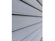 Close-up of the home's light gray siding, highlighting its clean lines and texture at 535 Hillcrest Dr, Garner, NC 27529