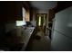 The kitchen with tile counters provides ample space for meal preparation and storage at 535 Hillcrest Dr, Garner, NC 27529