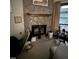 Living room area with stone fireplace, awaiting your decorating touch at 535 Hillcrest Dr, Garner, NC 27529