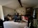 A spacious living room features a beamed ceiling, fireplace, and ample natural light at 535 Hillcrest Dr, Garner, NC 27529