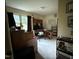 Office featuring carpet, desk, shelving, and window that provides natural light at 535 Hillcrest Dr, Garner, NC 27529