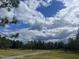 Image shows neighborhood community area with a sidewalk, swings and picnic tables at 59 Pine Vista Way, Sanford, NC 27332