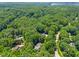 Aerial perspective of a home and its surroundings with lush trees and beautiful landscaping at 7401 Heartland Dr, Wake Forest, NC 27587