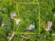 An aerial view showcases the property lines of a home surrounded by lush trees and neighborhood homes at 7401 Heartland Dr, Wake Forest, NC 27587