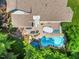 Overhead shot of a home featuring a refreshing backyard pool, patio area, and well-maintained landscaping at 7401 Heartland Dr, Wake Forest, NC 27587