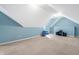 Bright attic space with ample room for storage or recreation, featuring neutral-colored walls and flooring at 7401 Heartland Dr, Wake Forest, NC 27587