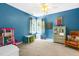 Bright bedroom with ample space for play and relaxation, featuring neutral carpeting at 7401 Heartland Dr, Wake Forest, NC 27587