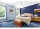 Charming bedroom with large windows, stylish furniture, and a comfortable queen sized bed at 7401 Heartland Dr, Wake Forest, NC 27587