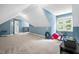 A well-lit bonus room with neutral carpeting, suitable for various activities at 7401 Heartland Dr, Wake Forest, NC 27587