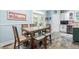 Cozy dining area featuring a large table with chairs and barstools in a well-lit kitchen at 7401 Heartland Dr, Wake Forest, NC 27587