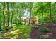 Stately brick home with lush lawn, shade trees, and attractive landscaping creating curb appeal at 7401 Heartland Dr, Wake Forest, NC 27587
