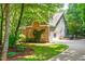 Beautiful home featuring a brick facade, lush lawn, two-car garage, and mature shade trees at 7401 Heartland Dr, Wake Forest, NC 27587